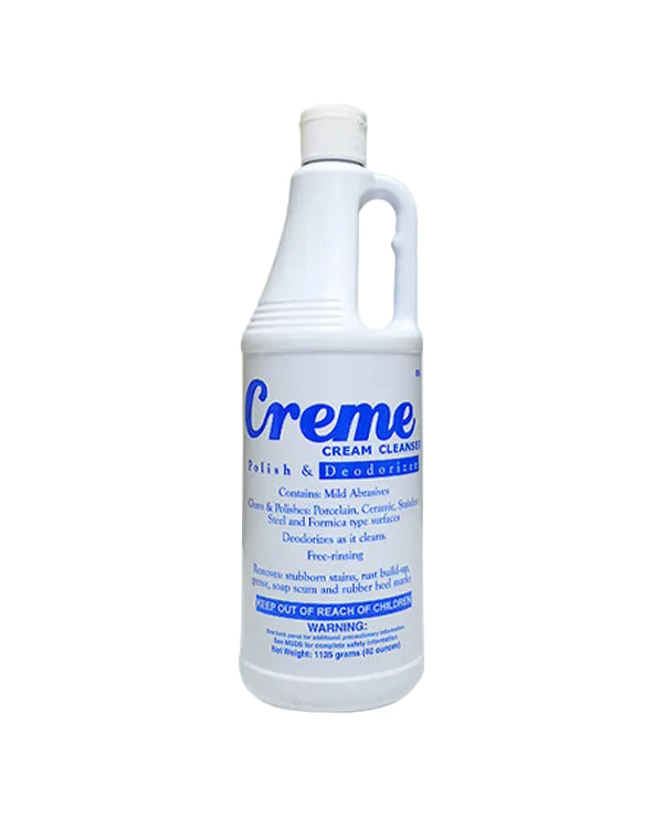 Bottle of Creme Cream Cleanser on a light blue background